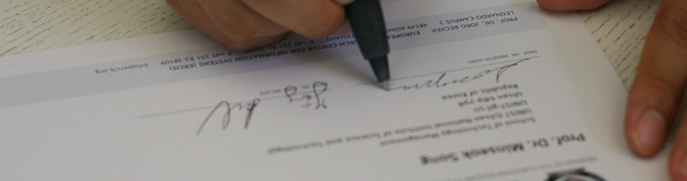 Minseok signing the ERCIS Membership Certificate